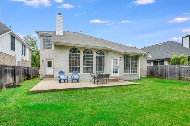 4933 China Garden Dr, Austin, TX 78730 - rear view of house featuring a patio, a chimney, and brick siding
