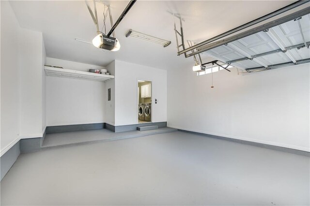 4933 China Garden Dr, Austin, TX 78730 - garage featuring separate washer and dryer and a garage door opener