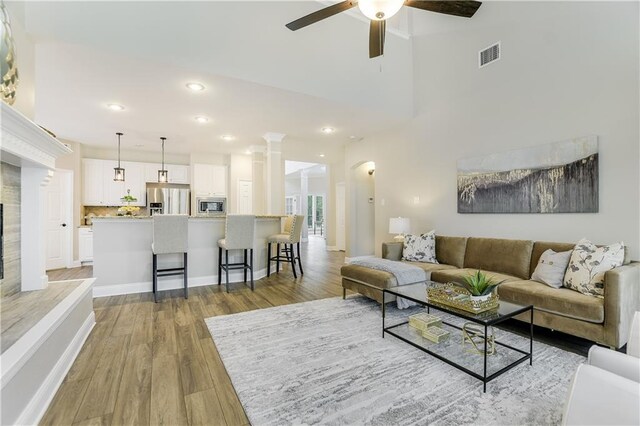4933 China Garden Dr, Austin, TX 78730 - living room featuring ornate columns, ceiling fan, wood finished floors, and recessed lighting