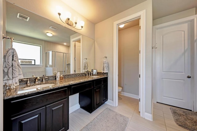 1816 Ficuzza Way, Leander, TX 78641 - bathroom featuring a stall shower, double vanity, and tile patterned flooring