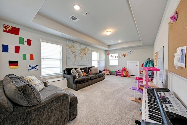 1816 Ficuzza Way, Leander, TX 78641 - carpeted living room with a raised ceiling, heating unit, and recessed lighting