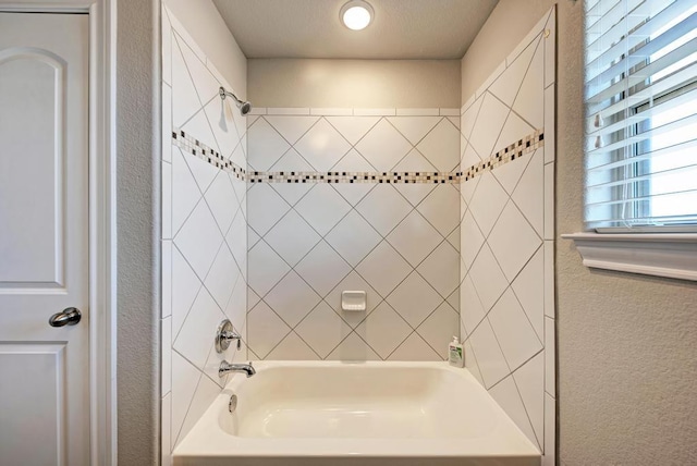1816 Ficuzza Way, Leander, TX 78641 - bathroom featuring bathtub / shower combination and a textured wall