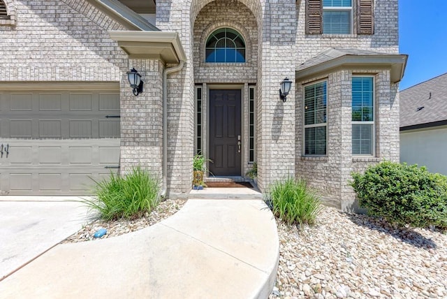 1816 Ficuzza Way, Leander, TX 78641 - view of exterior entry with a garage and brick siding