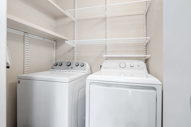 laundry area with washing machine and dryer