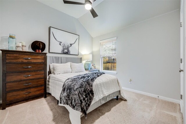 bedroom featuring vaulted ceiling, baseboards, carpet floors, and ceiling fan