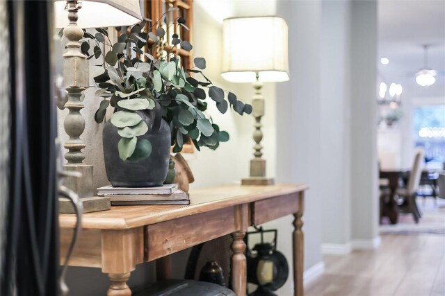foyer with baseboards and wood finished floors