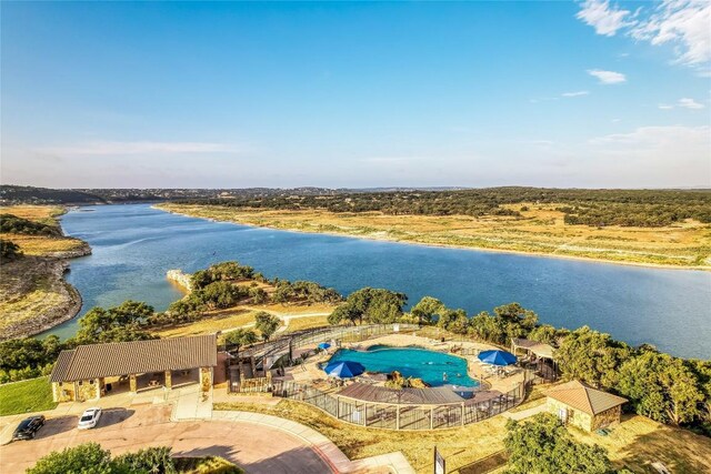 aerial view of a nearby body of water and a pool