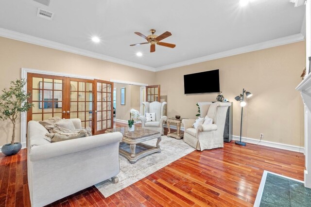 living room featuring french doors, ceiling fan, wood finished floors, ornamental molding, and baseboards
