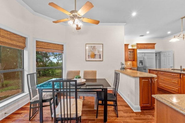 8900 Bell Mountain Dr, Austin, TX 78730 - dining space featuring ornamental molding, a ceiling fan, wood finished floors, and recessed lighting