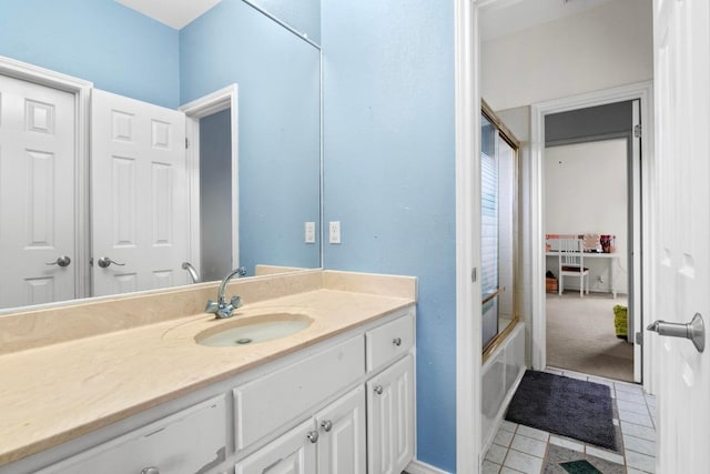 8900 Bell Mountain Dr, Austin, TX 78730 - bathroom featuring vanity, tile patterned floors, and enclosed tub / shower combo