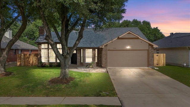 2310 Raintree Path, Round Rock, TX 78664 - view of front of home with a garage, concrete driveway, and brick siding