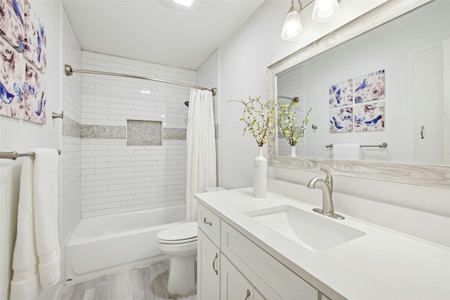 2627 Oak Meadow Dr, Round Rock, TX 78681 - full bathroom featuring toilet, wood finished floors, shower / tub combo with curtain, and vanity