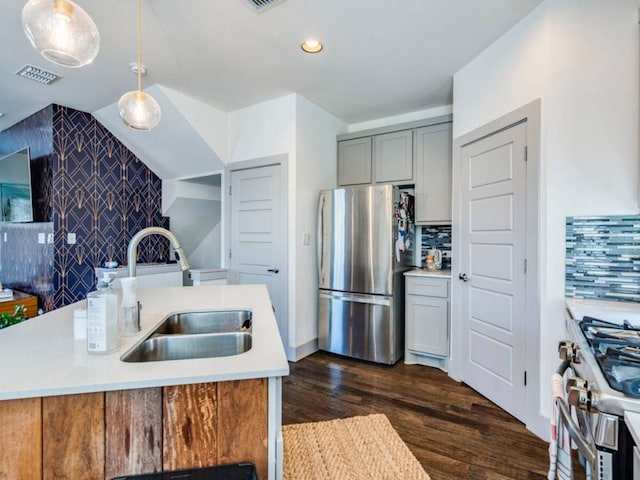 604 Allen St Unit 103, Austin, TX 78702 - kitchen featuring stainless steel appliances, a sink, gray cabinets, light countertops, and dark wood-style floors