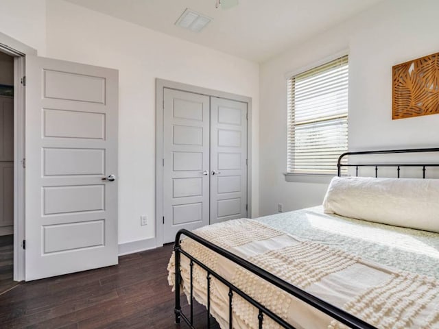 604 Allen St Unit 103, Austin, TX 78702 - bedroom featuring a closet and dark wood-type flooring