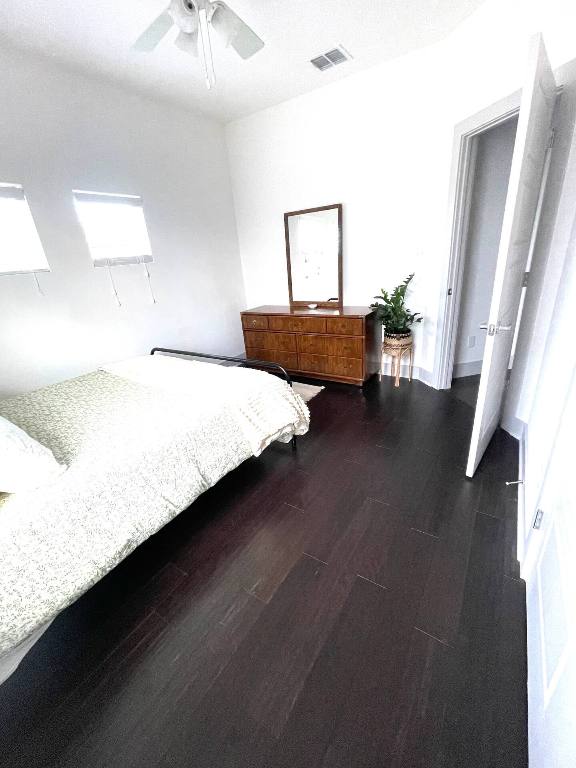 604 Allen St Unit 103, Austin, TX 78702 - bedroom featuring dark wood-type flooring and a ceiling fan