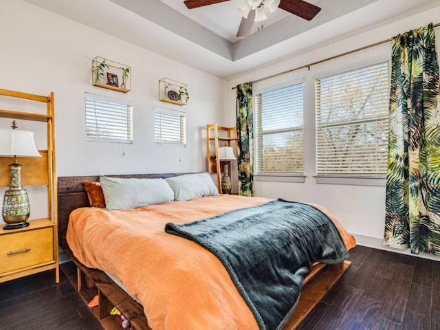 604 Allen St Unit 103, Austin, TX 78702 - bedroom featuring dark wood-style floors, a raised ceiling, and ceiling fan