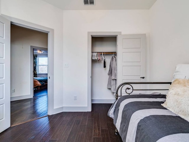 604 Allen St Unit 103, Austin, TX 78702 - bedroom featuring wood finished floors, baseboards, and a closet