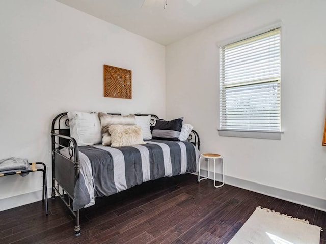 604 Allen St Unit 103, Austin, TX 78702 - bedroom featuring wood finished floors, baseboards, and a ceiling fan