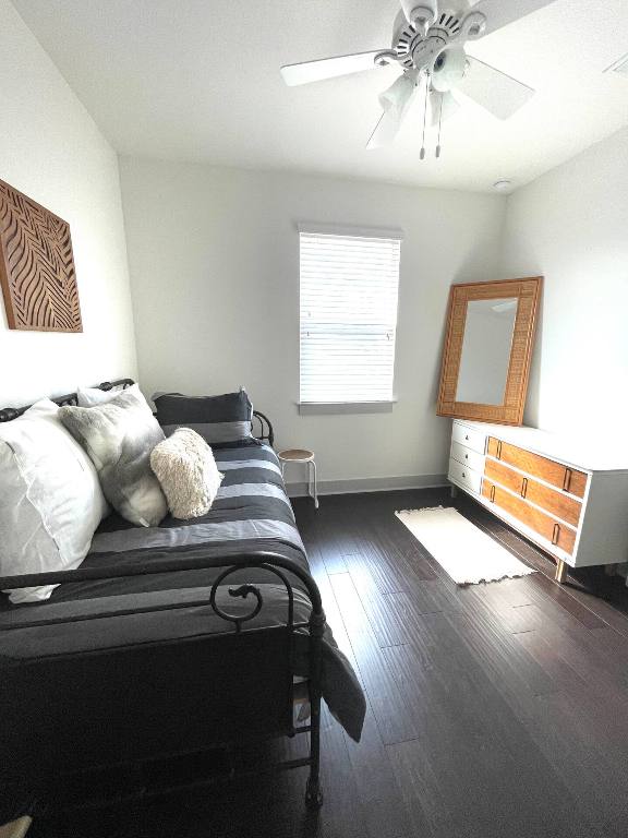 604 Allen St Unit 103, Austin, TX 78702 - bedroom featuring hardwood / wood-style flooring, ceiling fan, and baseboards