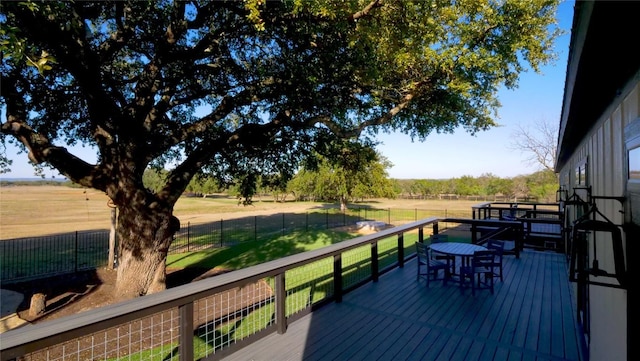 wooden deck featuring outdoor dining area
