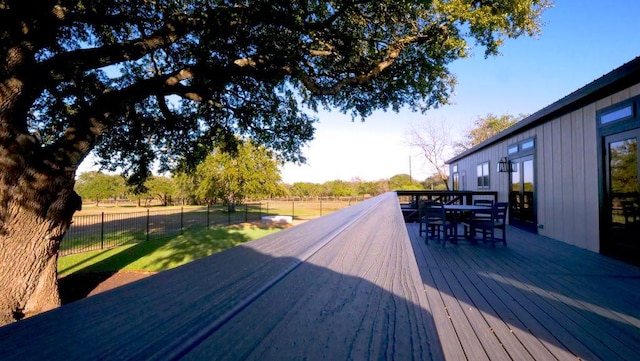 wooden deck with outdoor dining space
