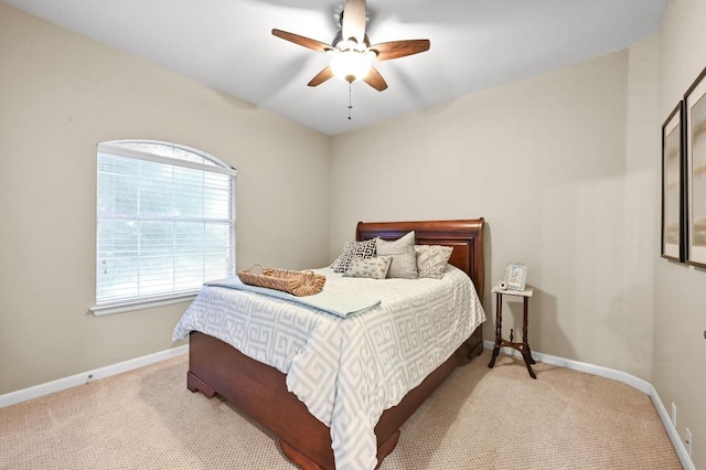 carpeted bedroom with baseboards and ceiling fan