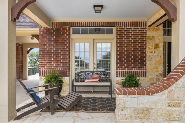 view of exterior entry featuring french doors