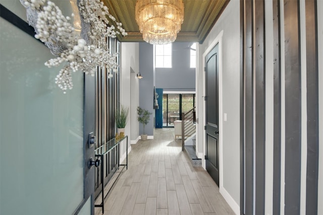 1506 Fox Sparrow Trl, Cedar Park, TX 78613 - hallway featuring a chandelier, light wood-style flooring, and ornamental molding