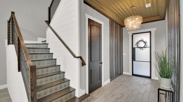 1506 Fox Sparrow Trl, Cedar Park, TX 78613 - foyer featuring wood ceiling, stairway, a chandelier, and light wood-style flooring