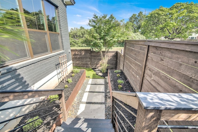1506 Fox Sparrow Trl, Cedar Park, TX 78613 - view of side of property with a garden and a fenced backyard