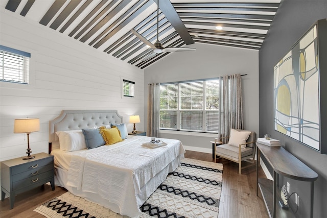 1506 Fox Sparrow Trl, Cedar Park, TX 78613 - bedroom featuring multiple windows, wood finished floors, lofted ceiling, and wooden walls