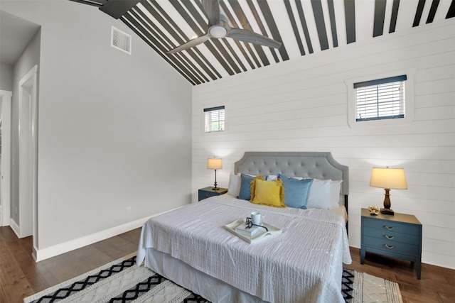1506 Fox Sparrow Trl, Cedar Park, TX 78613 - bedroom with lofted ceiling, wood finished floors, wooden walls, and baseboards