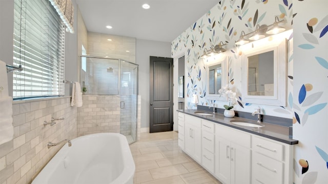 1506 Fox Sparrow Trl, Cedar Park, TX 78613 - bathroom featuring a shower stall, a tub to relax in, double vanity, and recessed lighting
