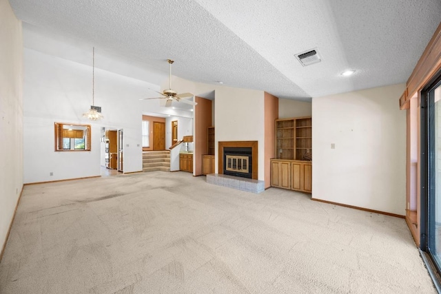 6820 N Cypress Pt Unit 22, Austin, TX 78746 - unfurnished living room with a textured ceiling, light carpet, baseboards, and a glass covered fireplace