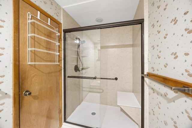 6820 N Cypress Pt Unit 22, Austin, TX 78746 - bathroom featuring wallpapered walls and a shower stall