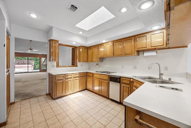 6820 N Cypress Pt Unit 22, Austin, TX 78746 - kitchen with a sink, light colored carpet, light tile patterned flooring, a skylight, and light countertops