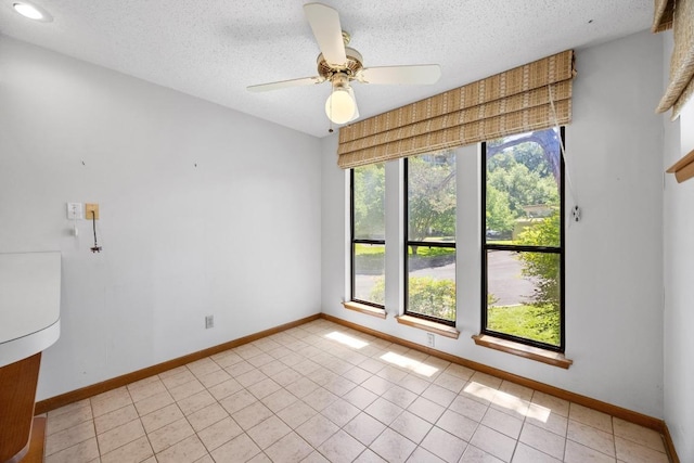 6820 N Cypress Pt Unit 22, Austin, TX 78746 - spare room with healthy amount of natural light, baseboards, a textured ceiling, and ceiling fan