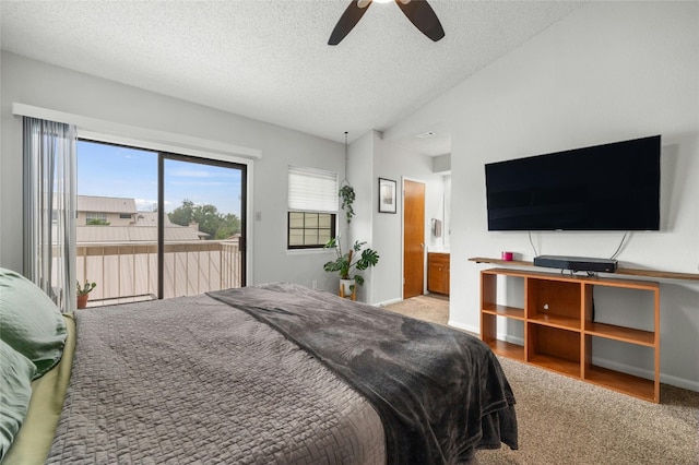 carpeted bedroom featuring access to exterior, a textured ceiling, and baseboards