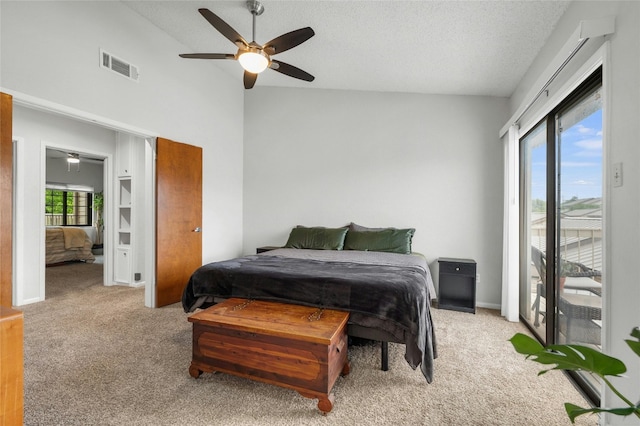 bedroom with light colored carpet, access to outside, a textured ceiling, and ceiling fan