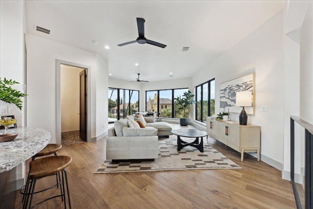 81 Applehead Island Dr, Horseshoe Bay, TX 78657 - living area featuring a ceiling fan, wood finished floors, baseboards, and recessed lighting