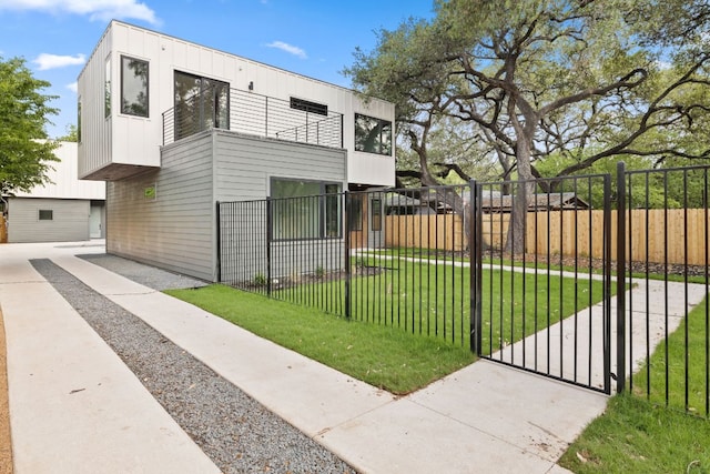 4407 Merle Dr Unit A, Austin, TX 78745 - view of home's exterior with a balcony and a gate