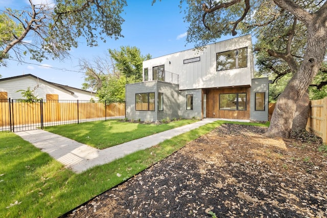 4407 Merle Dr Unit A, Austin, TX 78745 - back of house with a balcony and a fenced backyard