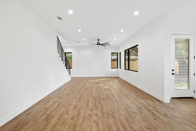 4407 Merle Dr Unit A, Austin, TX 78745 - unfurnished living room featuring recessed lighting, baseboards, light wood finished floors, stairway, and ceiling fan