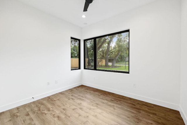 4407 Merle Dr Unit A, Austin, TX 78745 - spare room featuring baseboards, a ceiling fan, wood finished floors, and recessed lighting