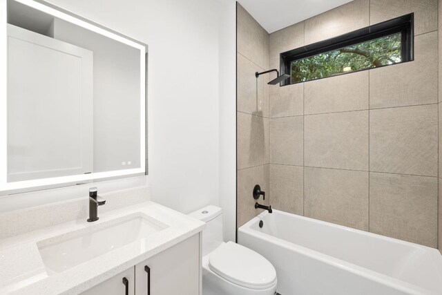 4407 Merle Dr Unit A, Austin, TX 78745 - bathroom featuring toilet, vanity, and shower / washtub combination
