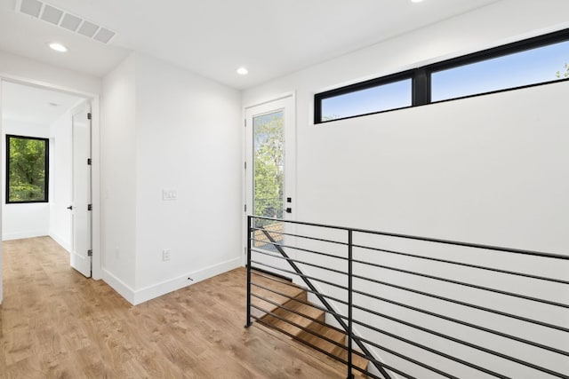 4407 Merle Dr Unit A, Austin, TX 78745 - hallway with an upstairs landing, light wood-type flooring, baseboards, and recessed lighting