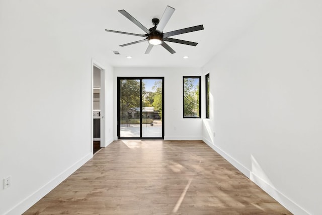 4407 Merle Dr Unit A, Austin, TX 78745 - spare room with a ceiling fan, wood finished floors, baseboards, and recessed lighting
