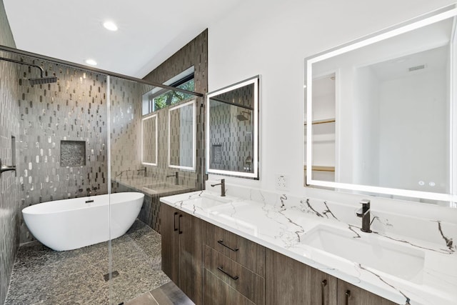4407 Merle Dr Unit A, Austin, TX 78745 - bathroom featuring a shower stall, a soaking tub, double vanity, and recessed lighting