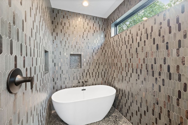 4407 Merle Dr Unit A, Austin, TX 78745 - bathroom with a soaking tub and wallpapered walls