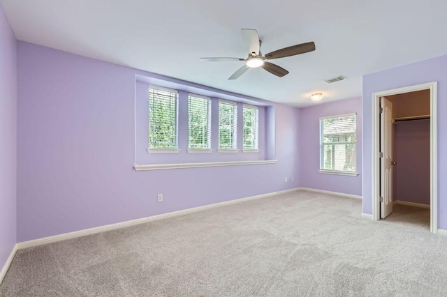 409 S Frontier Ln, Cedar Park, TX 78613 - unfurnished bedroom featuring carpet flooring, baseboards, a walk in closet, and ceiling fan